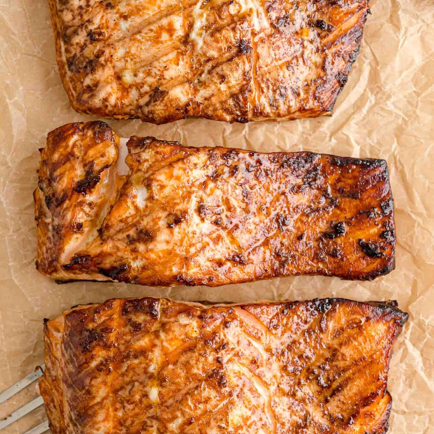 Three fillets of grilled salmon.
