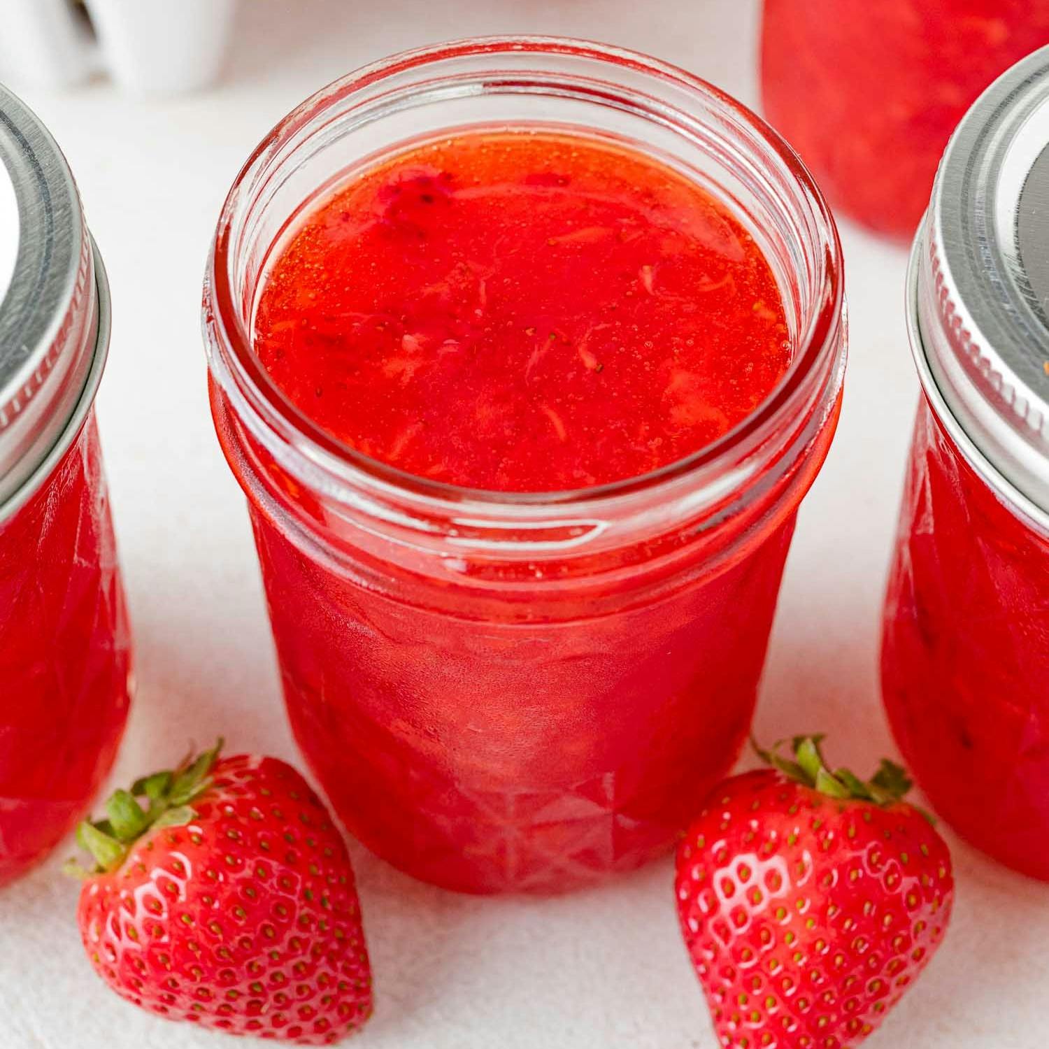 Strawberry freezer jam in a small jar.