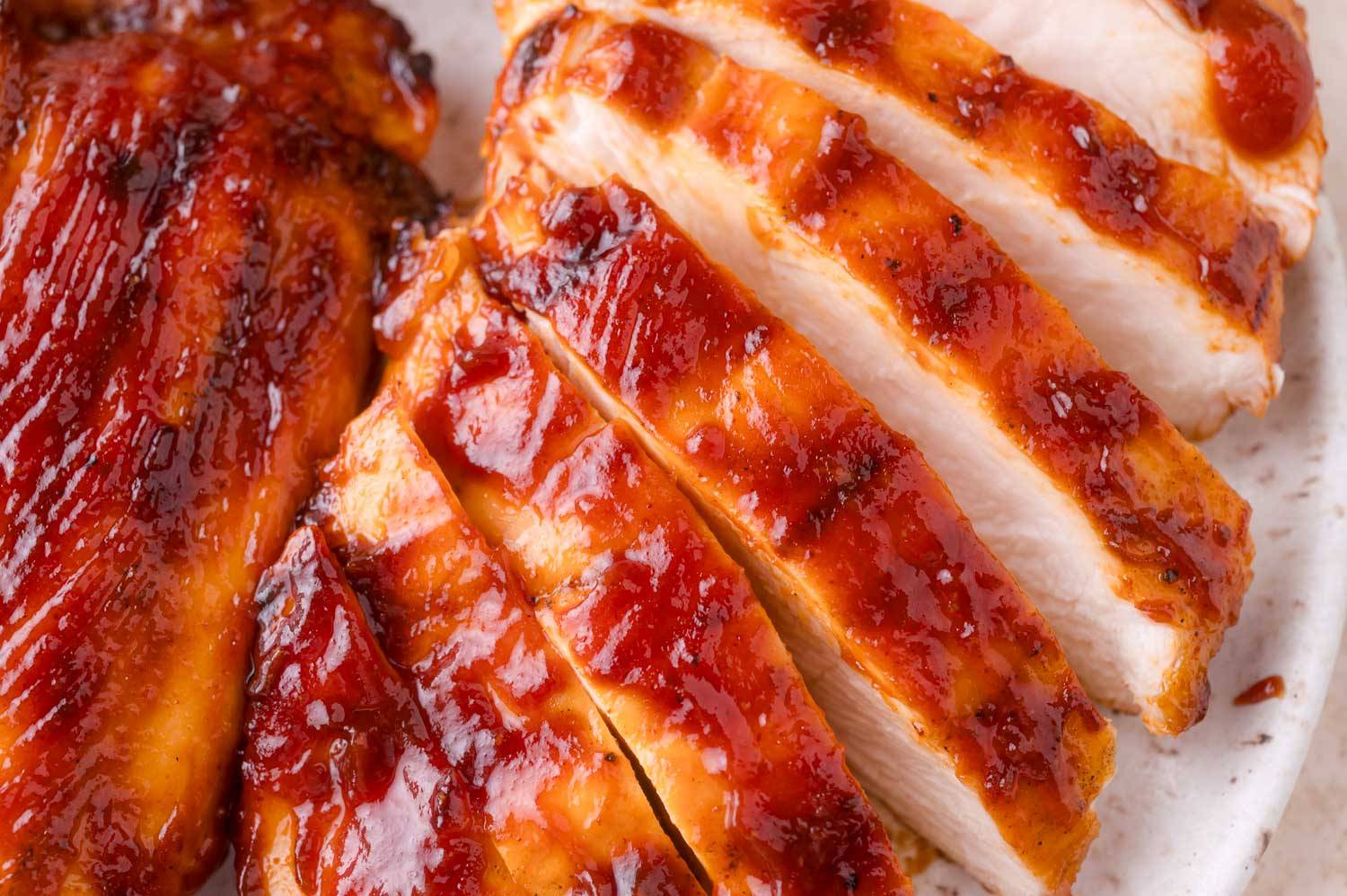 Close up of grilled bbq chicken, sliced.