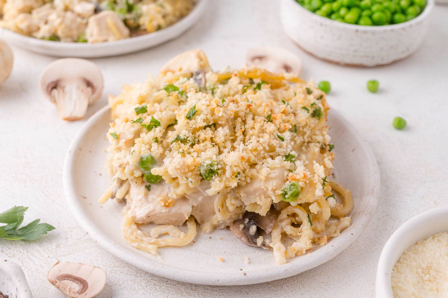 Piece of chicken tetrazzini on a plate.