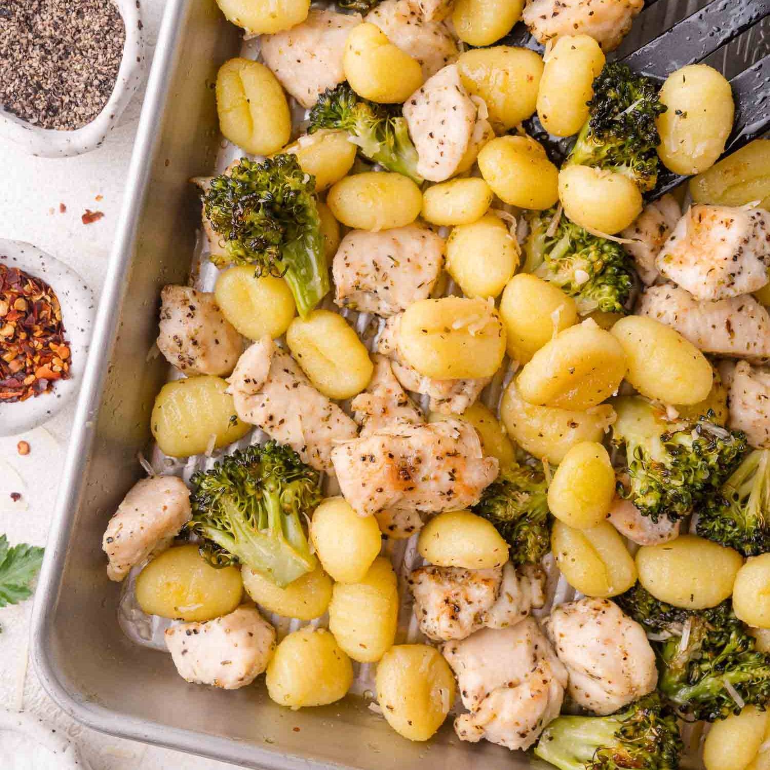 Gnocchi, chicken, and broccoli on a sheet pan.