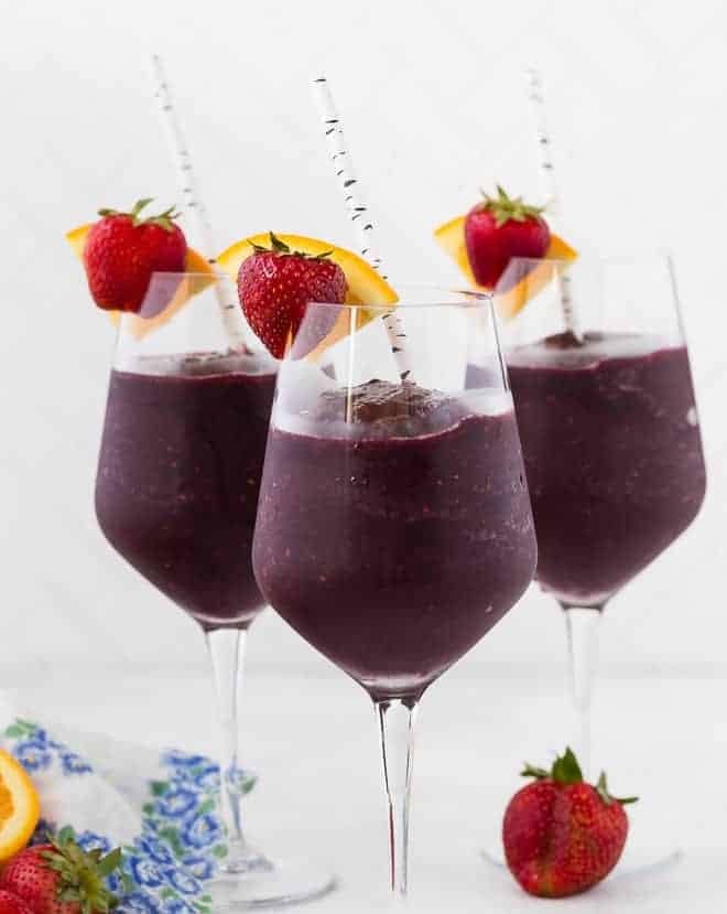 Three wine glasses full of frozen sangria.