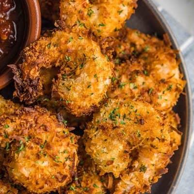 Coconut shrimp in a metal bowl or basket.