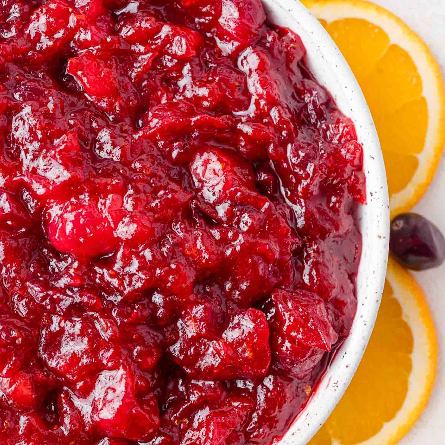 Cranberry sauce surrounded by orange slices.