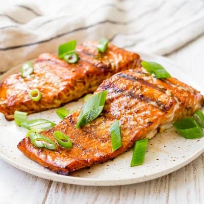 Grilled salmon fillets on a plate.