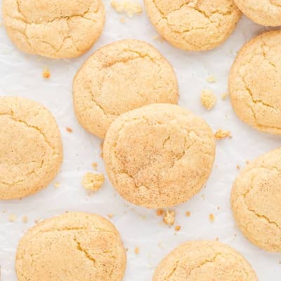 Snickerdoodle cookies on a white surface.