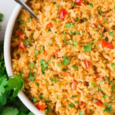 Overhead view of Mexican rice in a white bowl.