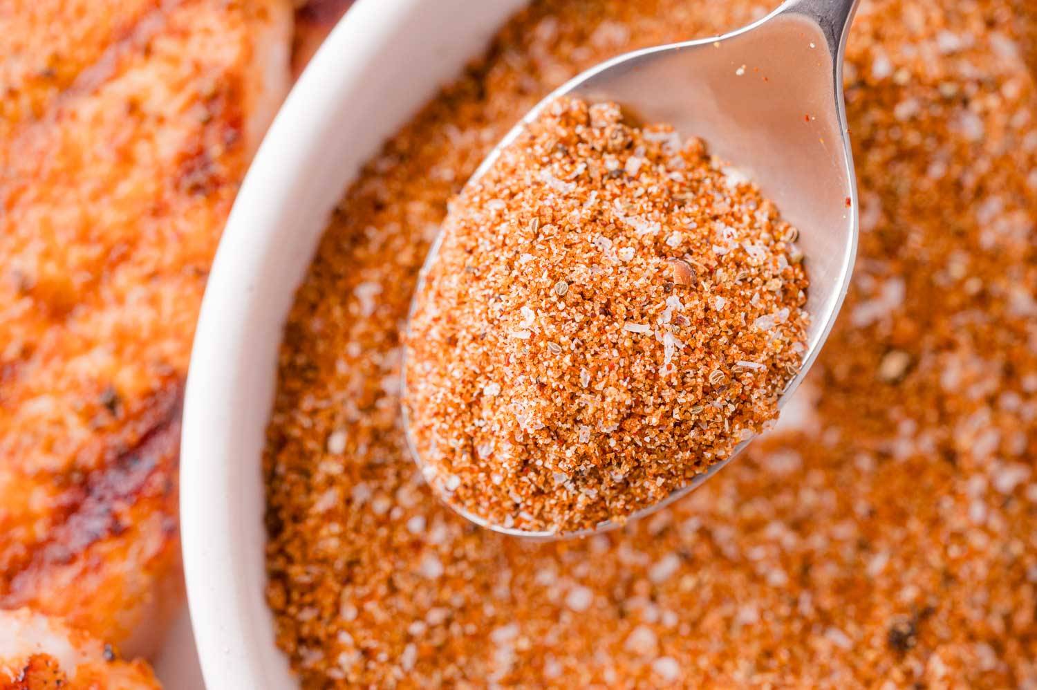 BBQ rub, some on a spoon, some in a bowl behind.