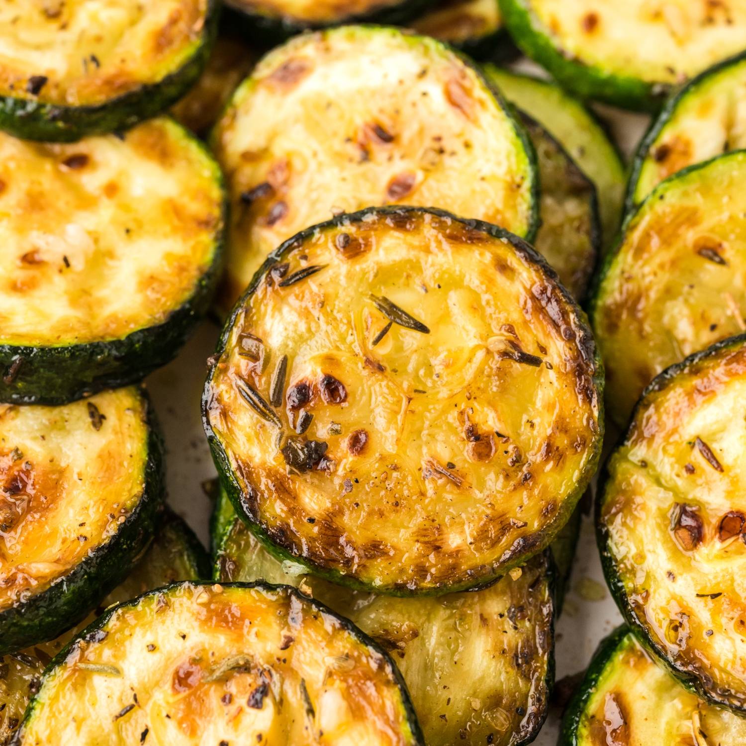 Close up of sautéed zucchini slices.