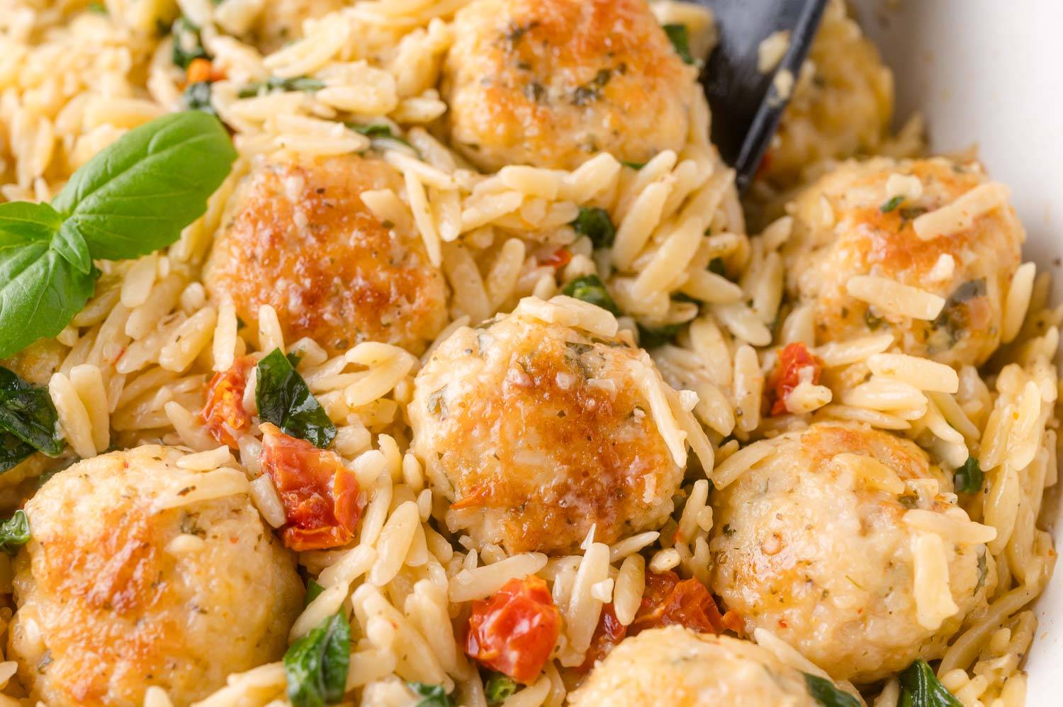 Chicken meatballs in orzo with spinach and sundried tomatoes.