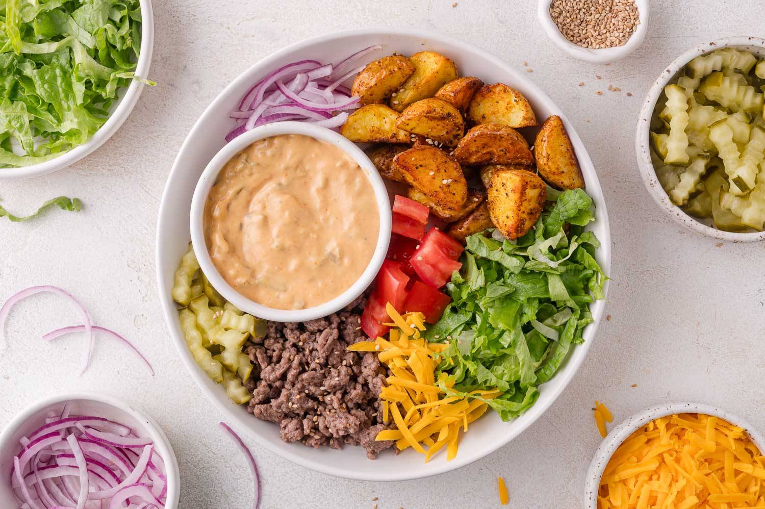 Burger bowl, with the components separate in a bowl.