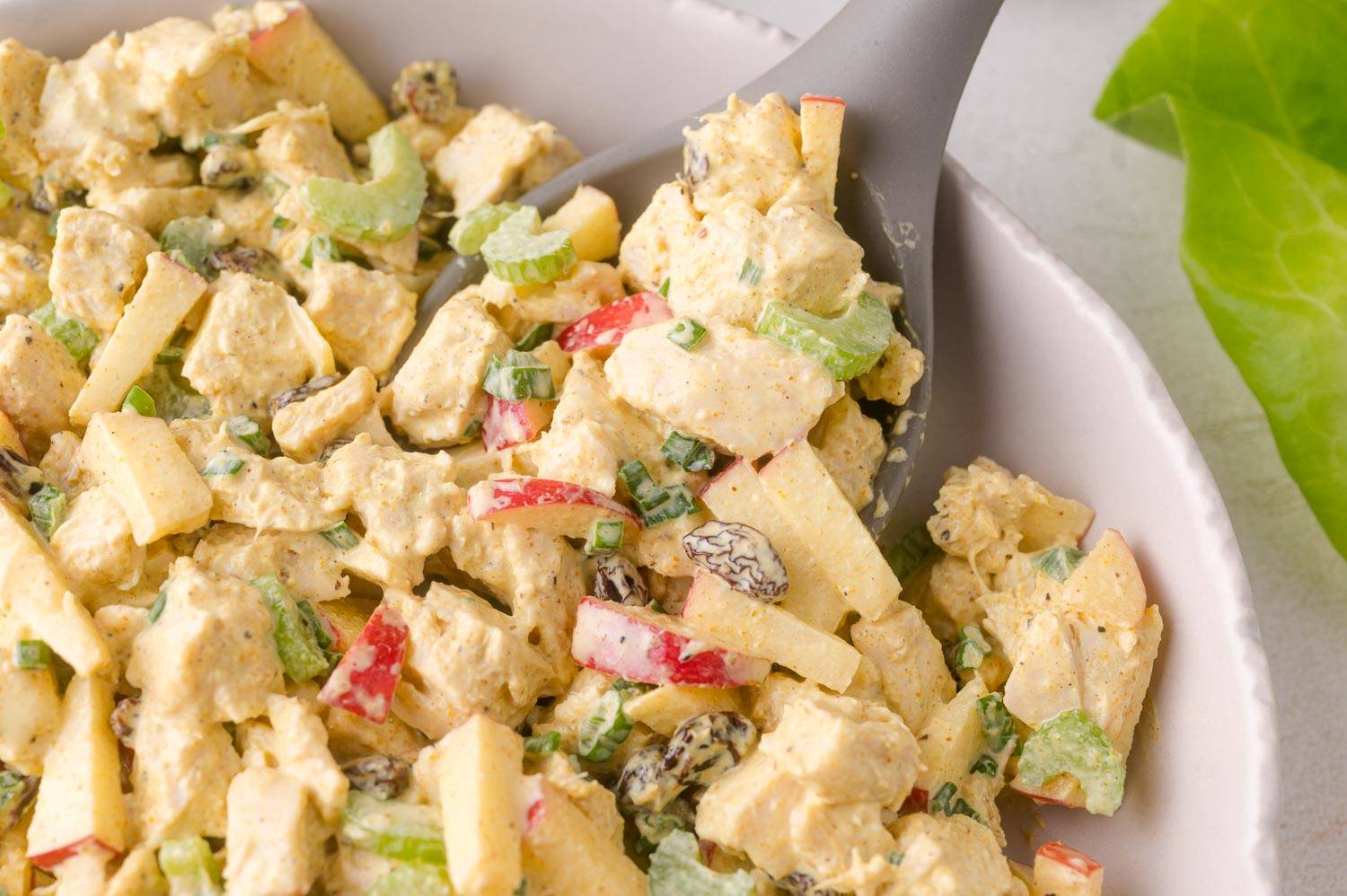 Curry chicken salad, with apples, raisins, and celery shown.