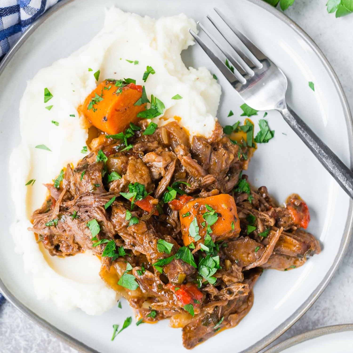 Italian pot roast served on top of potatoes.