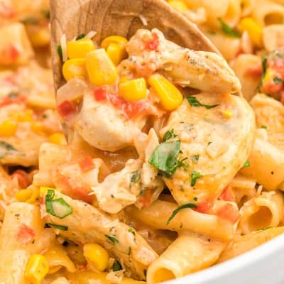 Cajun chicken pasta with wooden spoon..