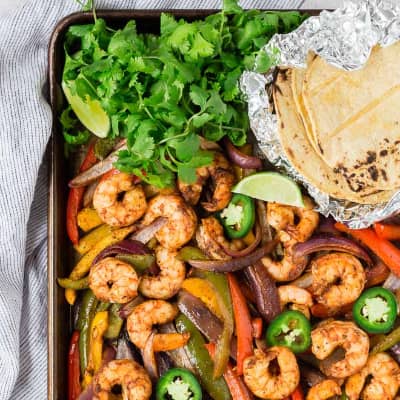 Shrimp fajitas on a sheet pan.