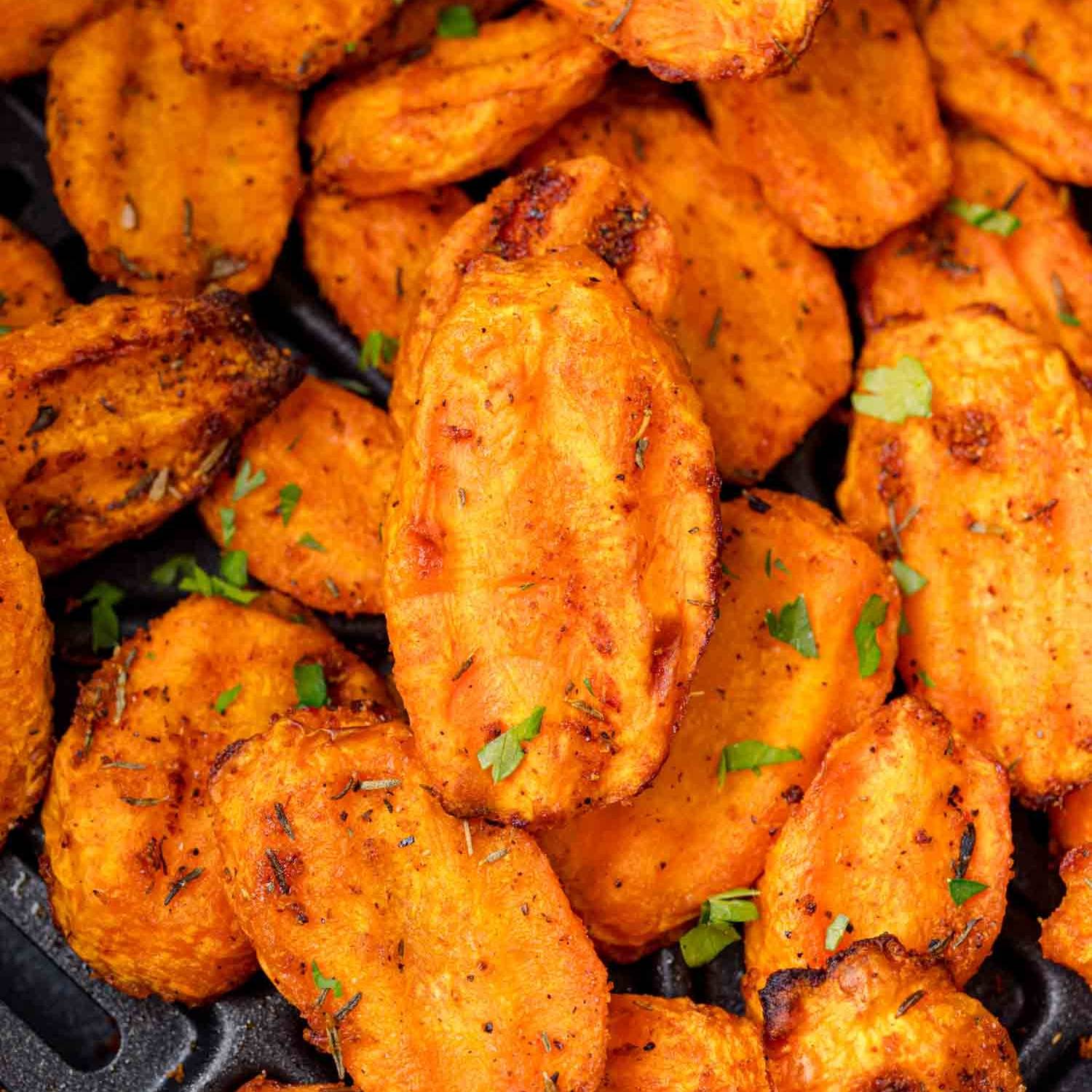 Air fryer carrots, topped with parsley.