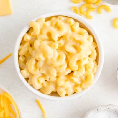 Microwave macaroni and cheese in white bowl..