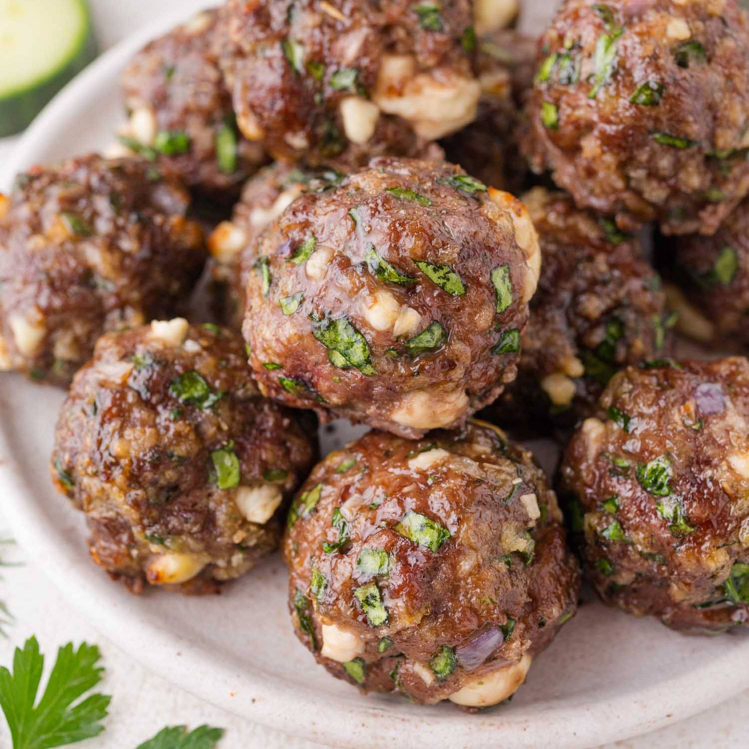 Greek meatballs on a white plate.