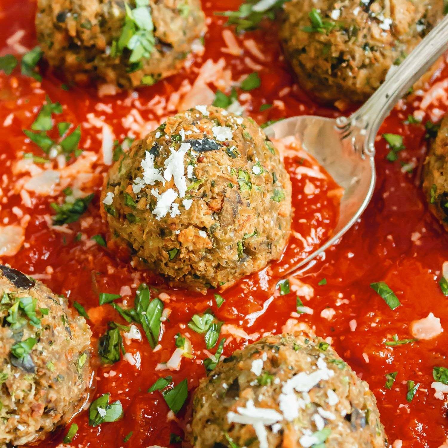Eggplant meatballs in a red tomato sauce.