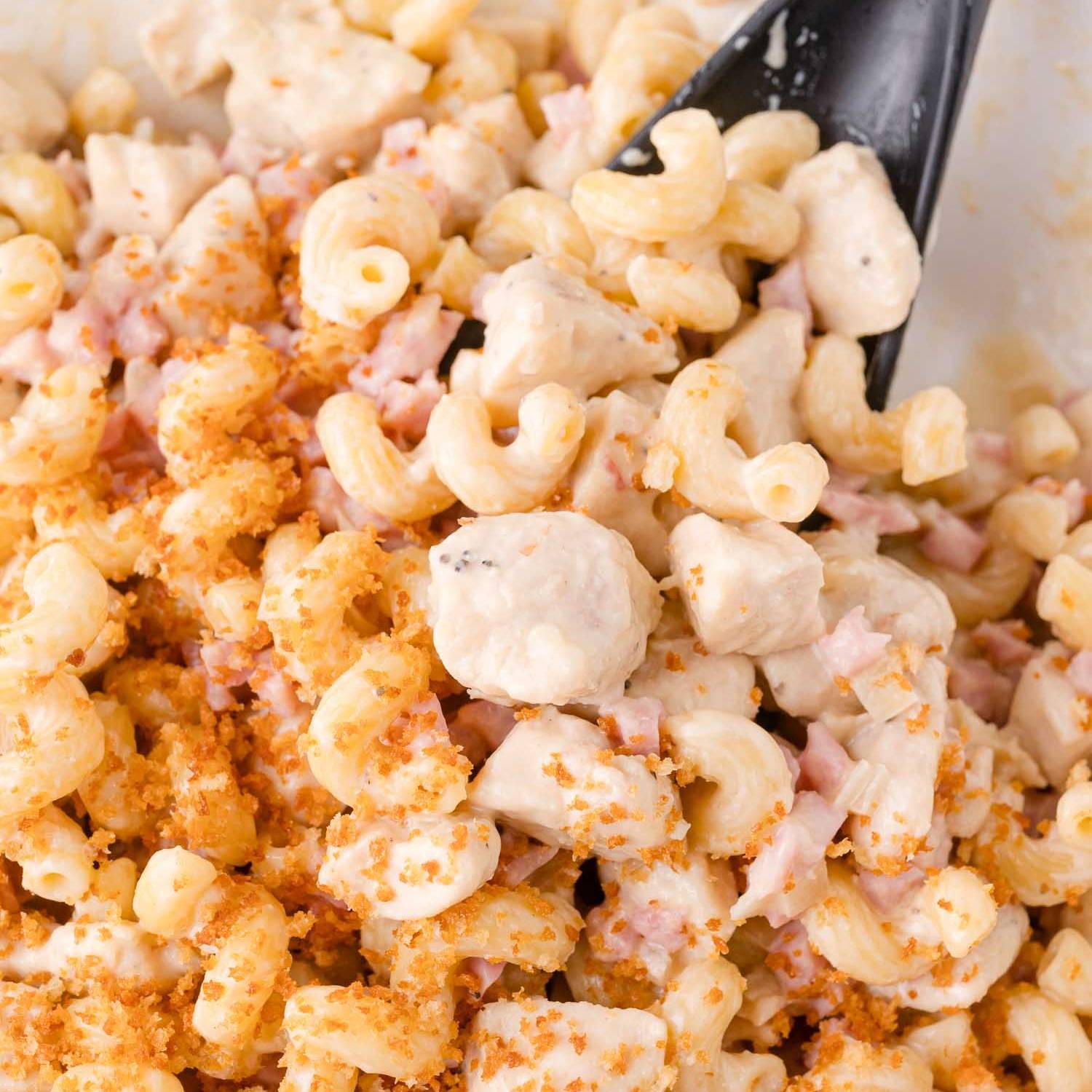 Pasta with ham, chicken, and toasted bread crumbs.