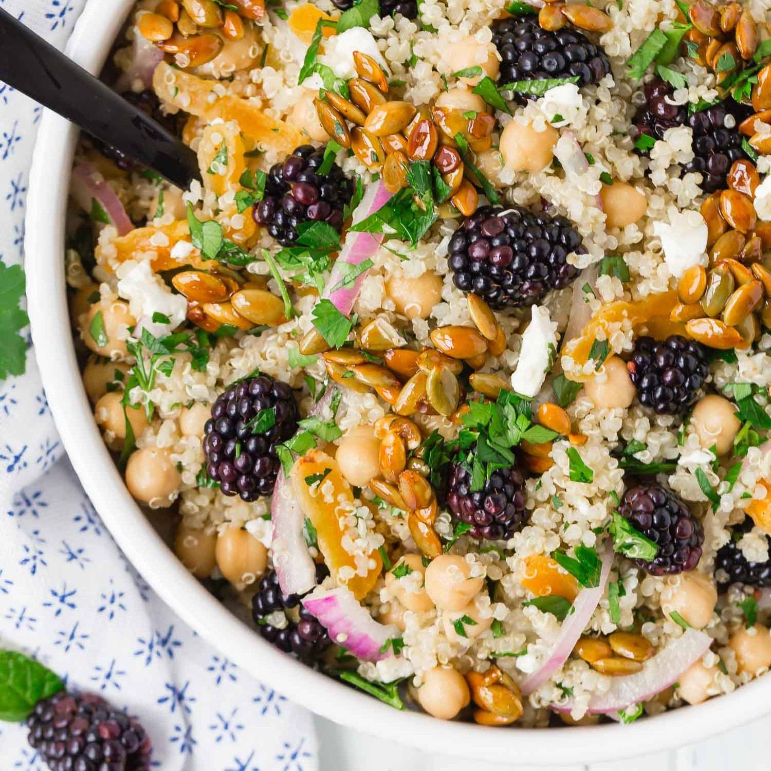 Salad with quinoa, blackberries, chickpeas, and candied pepitas.