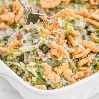 Green bean casserole in a white casserole dish.