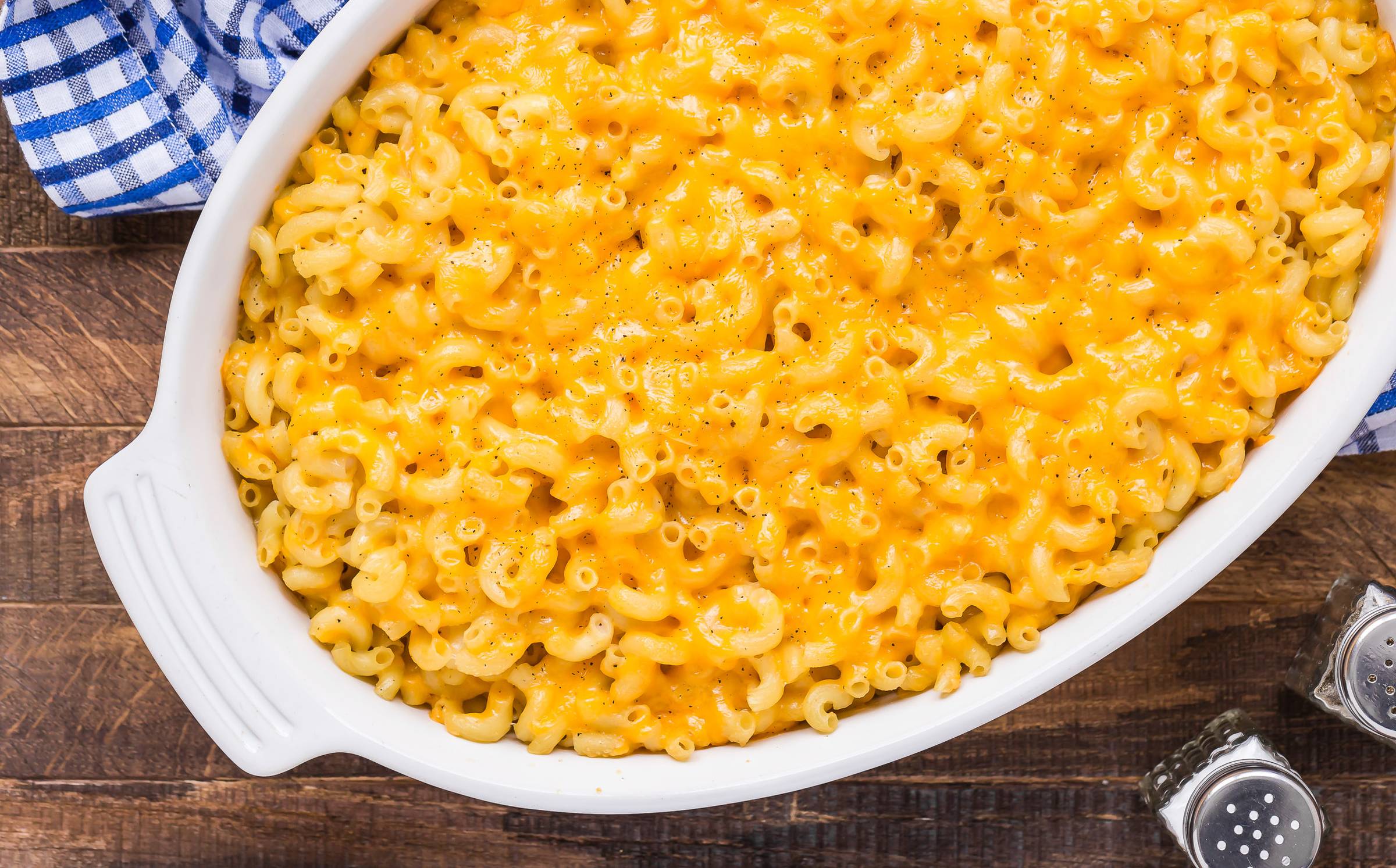 Baked macaroni and cheese in a white casserole dish.