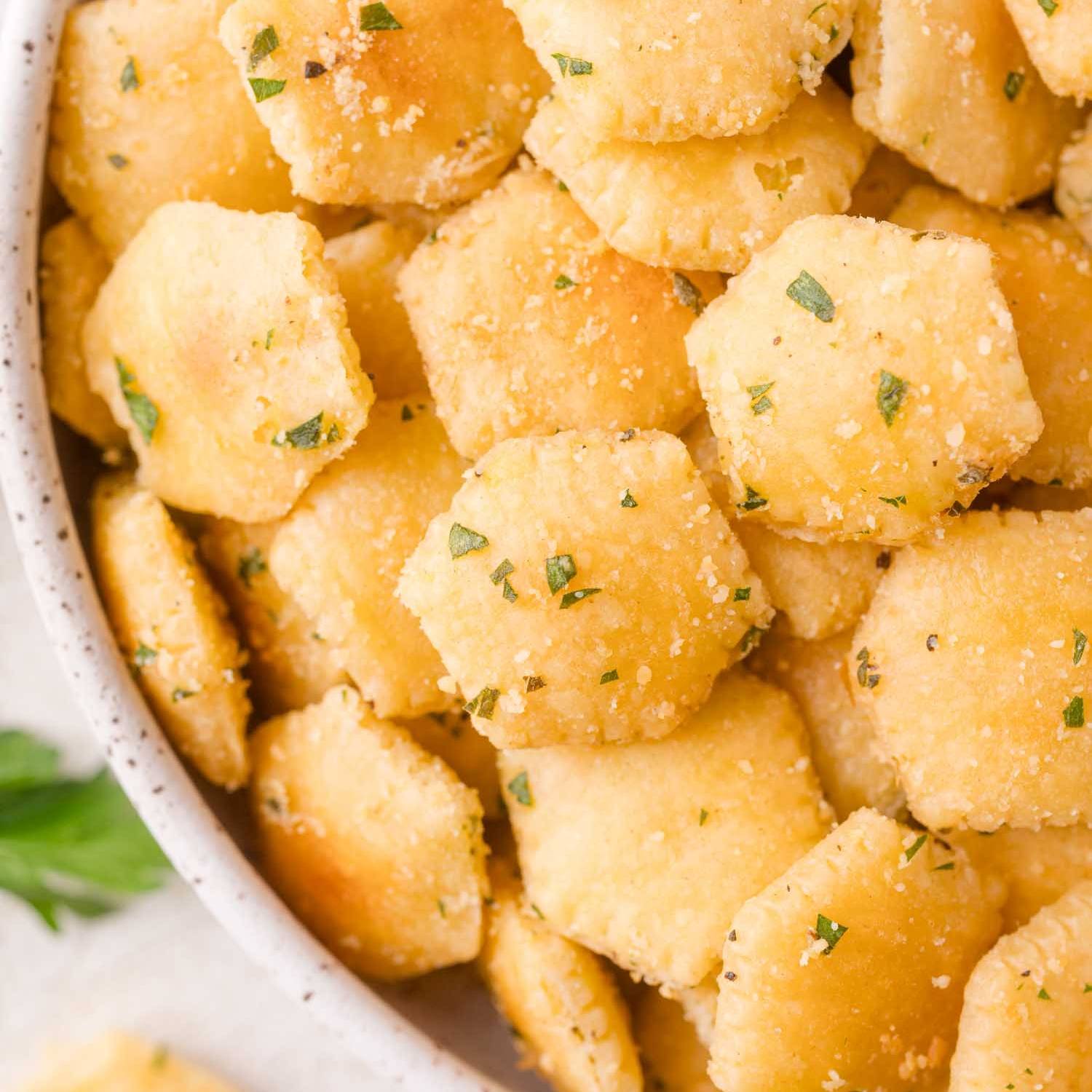 Oyster crackers tossed with green herbs and parmesan cheese.