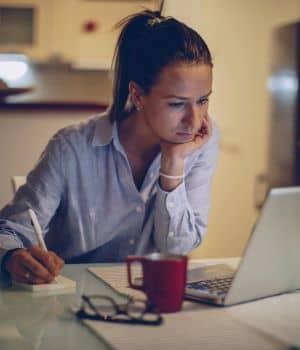 woman working late at her desk.