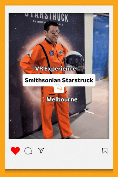 Person in an orange astronaut suit and helmet posing in front of a starry "Starstruck" backdrop, with on-screen text reading "VR Experience, Smithsonian Starstruck, Melbourne"