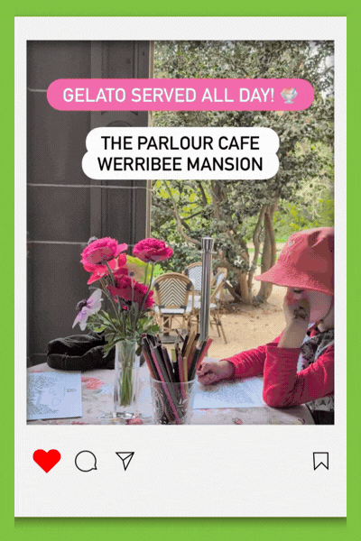 Video of a cafe day at Werribee Park showing striped umbrellas on the lawn in front of the mansion, a child eating gelato at a floral-covered table, another holding up a stretchy grilled cheese, and the mansion’s sandstone arches.