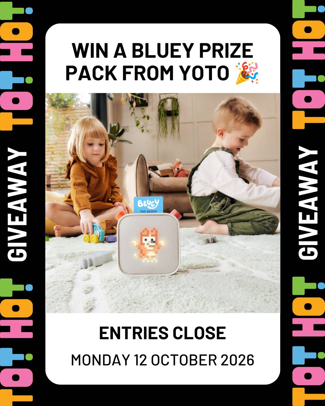Tot Hot or Not giveaway graphic with a black border and colourful logo lettering. Text reads Win a Bluey prize pack from Yoto, with a photo of two young children playing with toys on a cream rug beside a Yoto player showing a pixel Bluey. Text at the bottom reads Entries close Monday 12 October 2026.