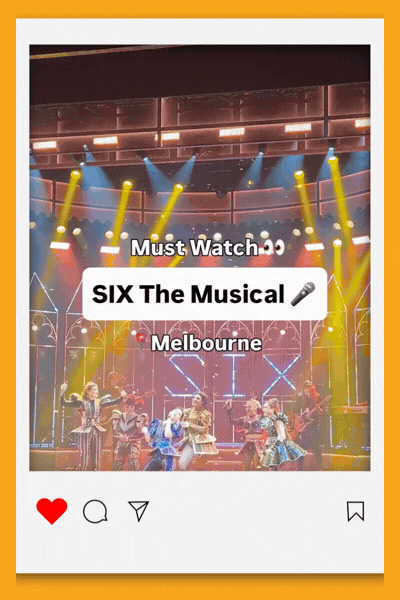 Six performers in bejewelled, pop-concert-style costumes dance and sing on a colourfully lit stage under the glowing 'SIX' set piece, with on-screen text reading 'Must Watch: SIX The Musical, Melbourne' and an audience visible in the foreground.