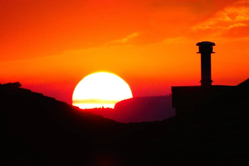Fiery sunset paints the sky orange.