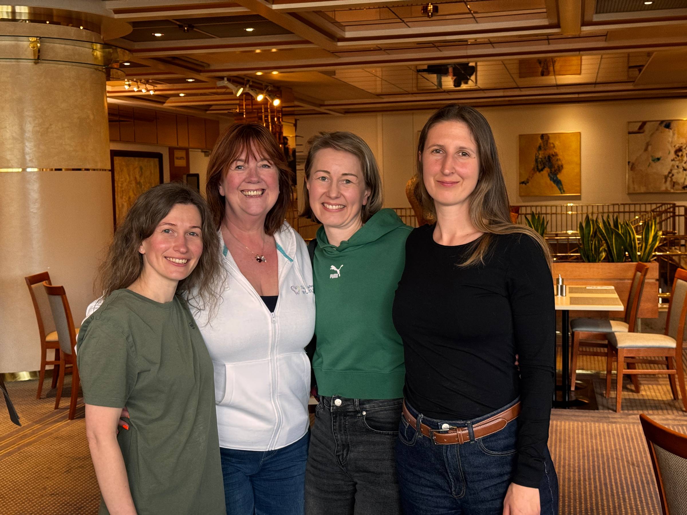Four women holding each other