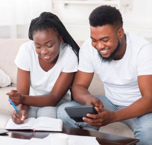 a couple happily talking about money