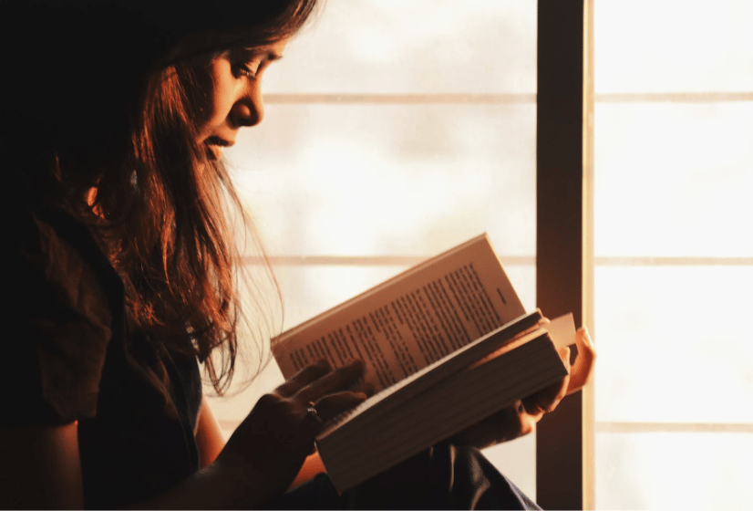 a lady reading a book 