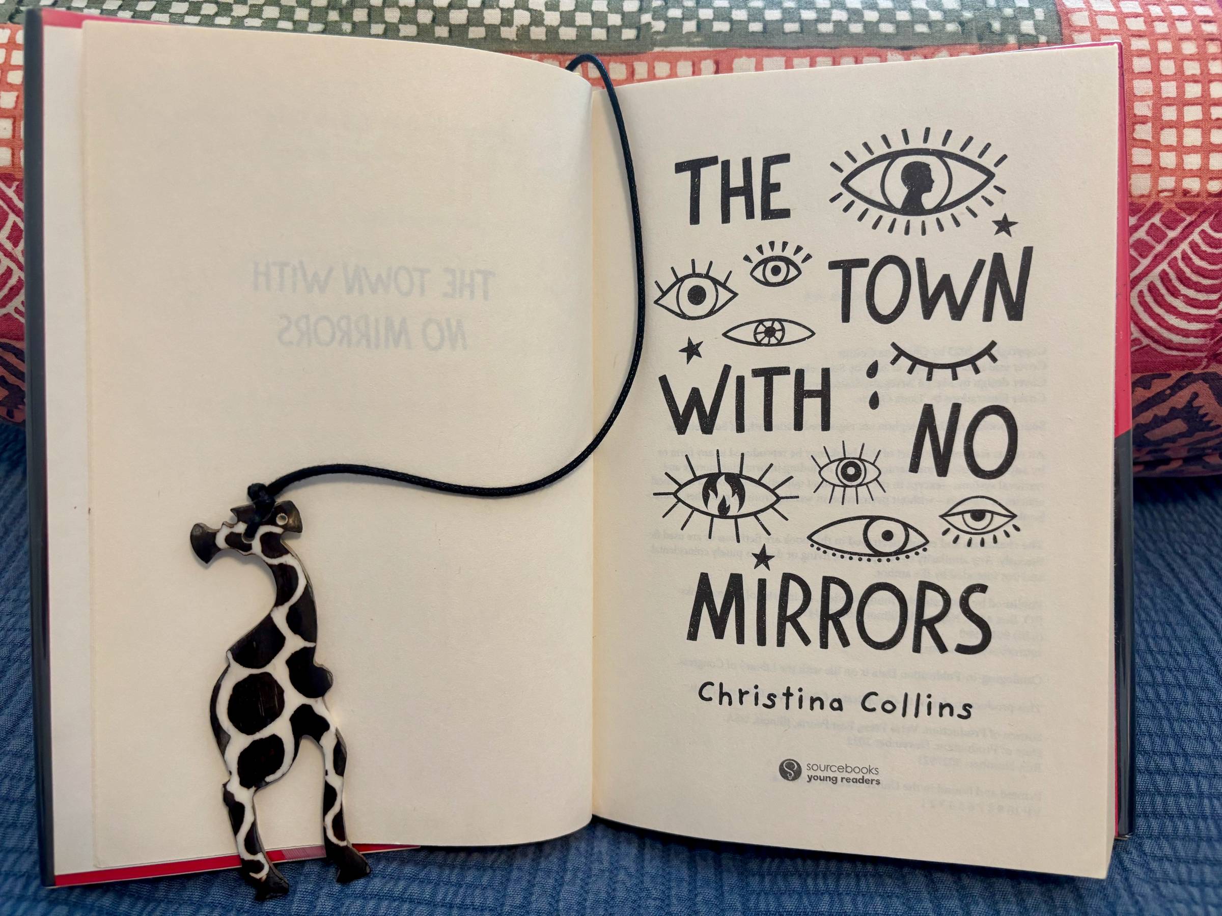 Photo of cover page for the book The Town with No Mirrors by Christina Collins