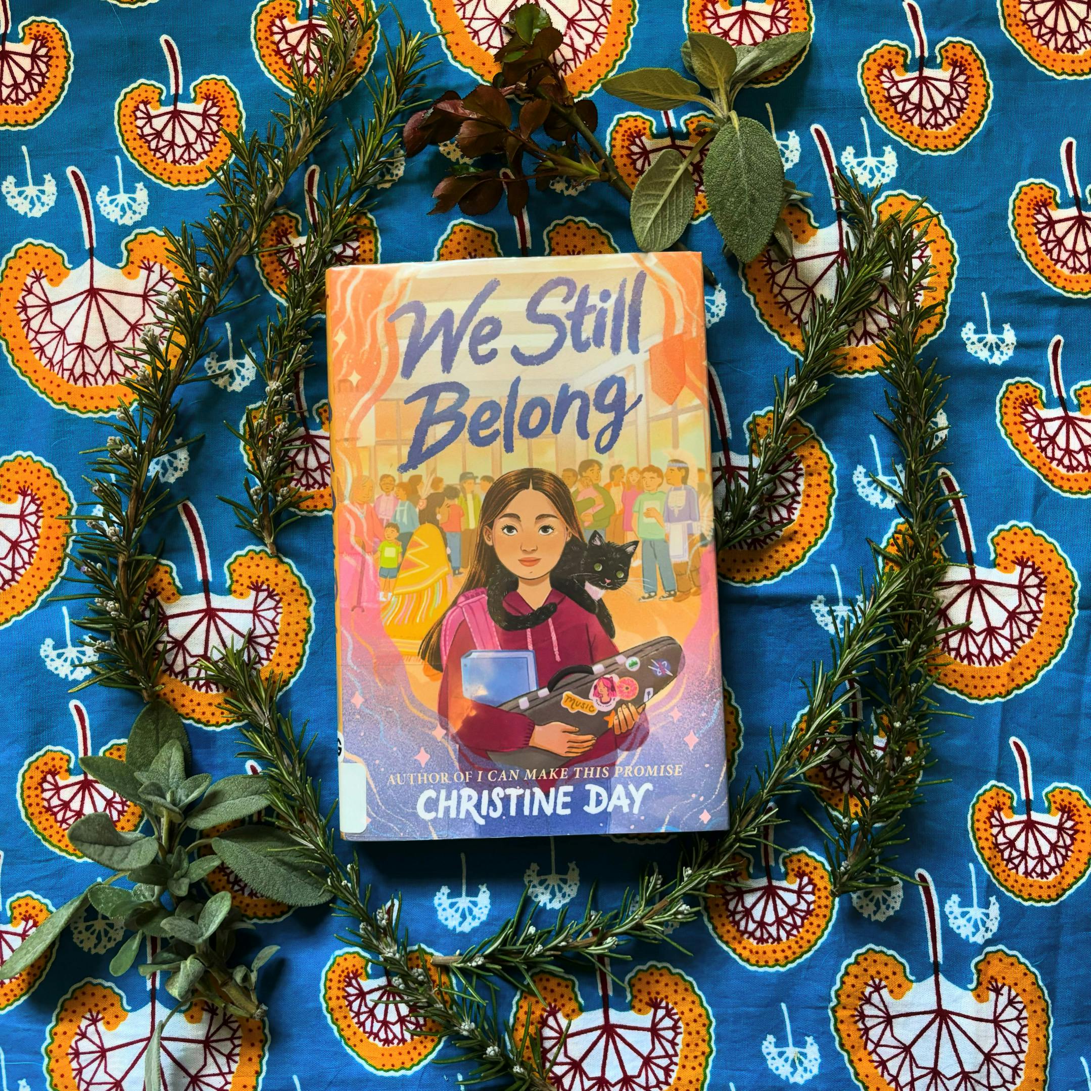 A photo of the cover of the book "We Still Belong" by Christine Day. 