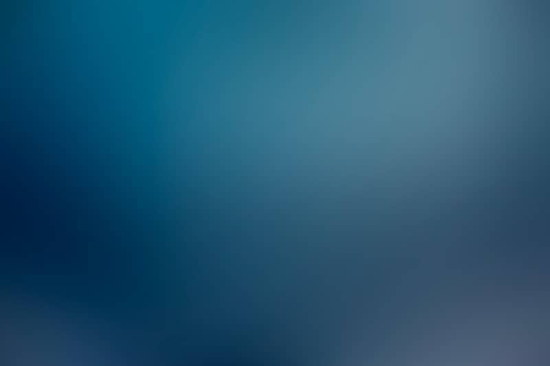 A smooth gradient of dark and light blue colors.