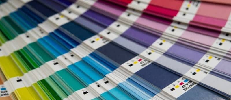 A bunch of different colors of paint on a table