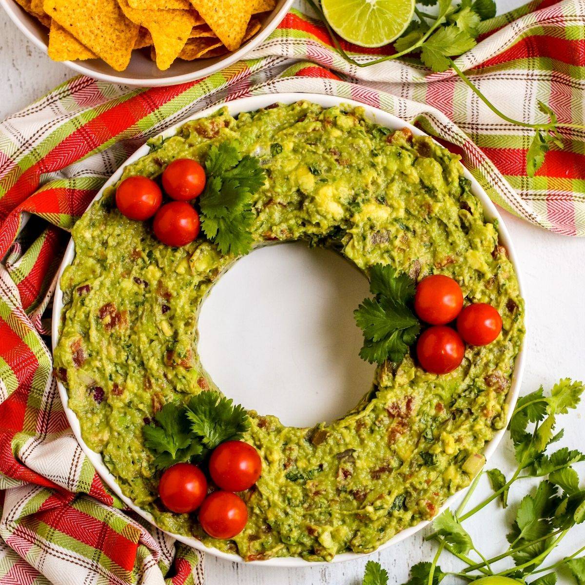 Platter of guacamole shaped like a Christmas wreath.