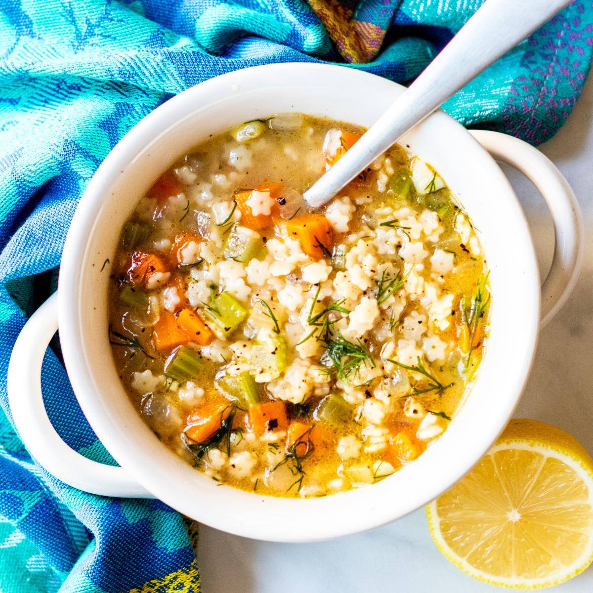 Bowl of soup with star-shaped noodles.