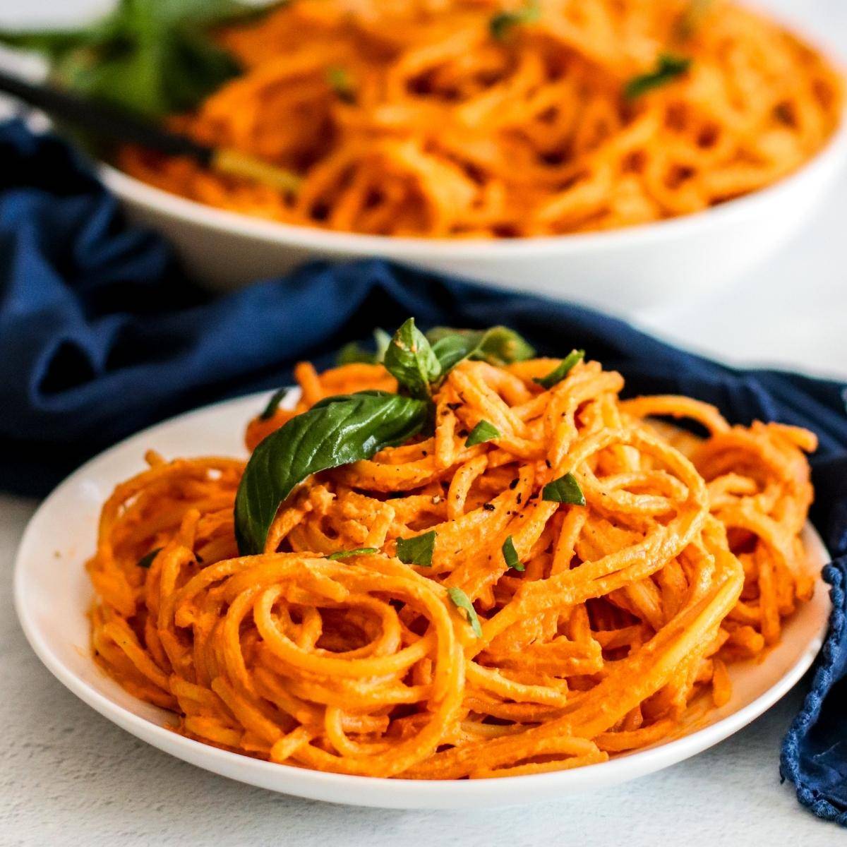 Spaghetti tossed with a creamy sun-dried tomato sauce made with cashews and garnished with fresh basil.