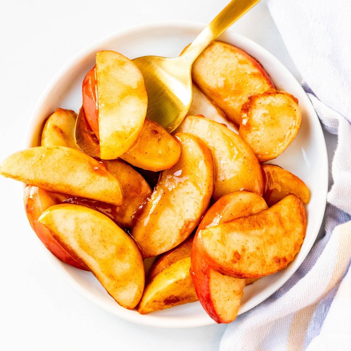 Baked apple slices on a plate.