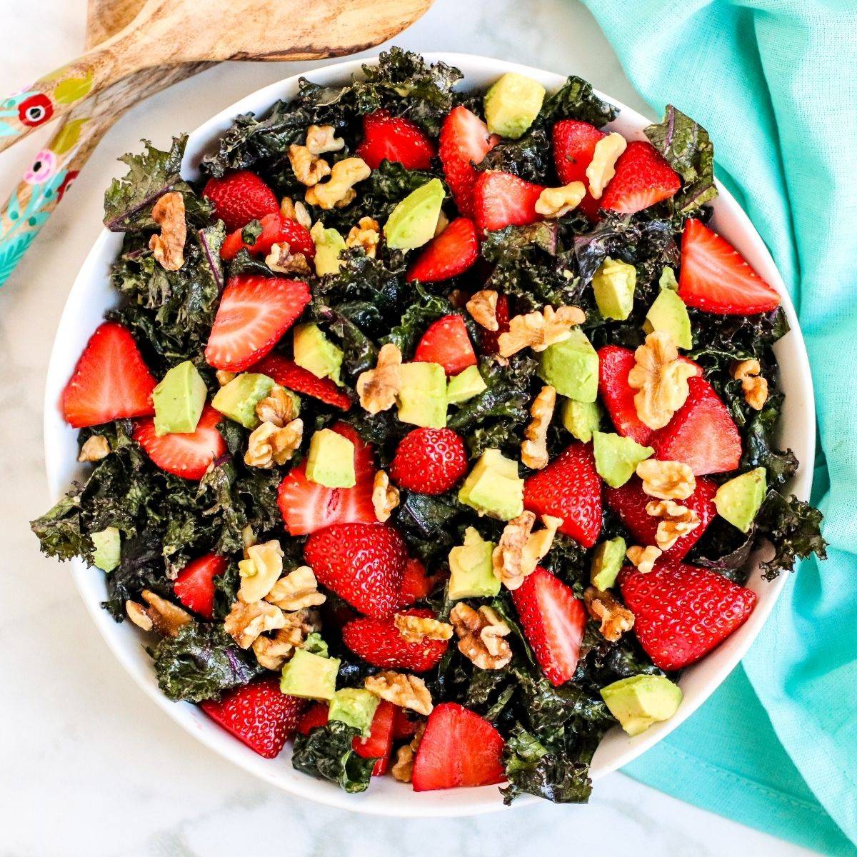 Avocado kale salad with strawberries and walnuts