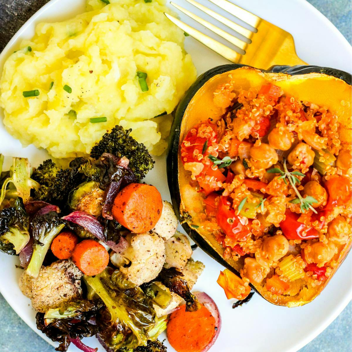 Olive oil mashed potatoes, stuffed acorn squash, and roasted vegetables.