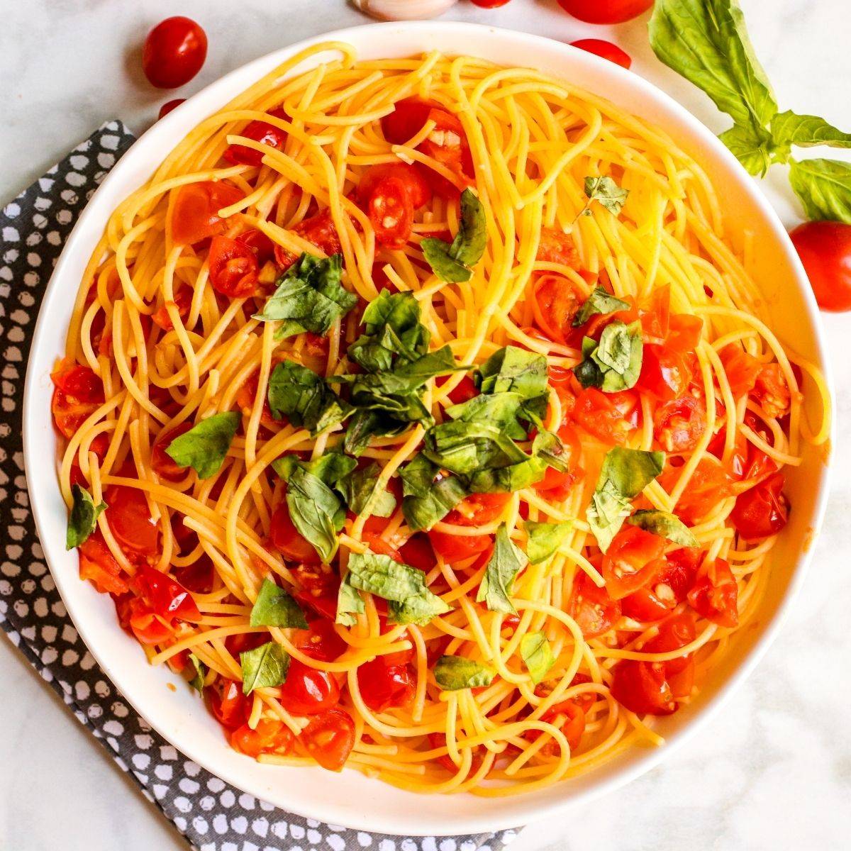 Angel hair pomodoro topped with fresh basil.