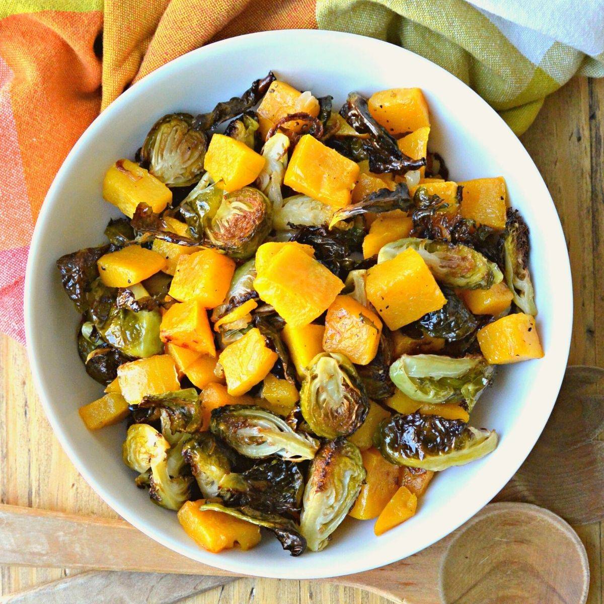 Bowl of roasted butternut squash and Brussels sprouts.