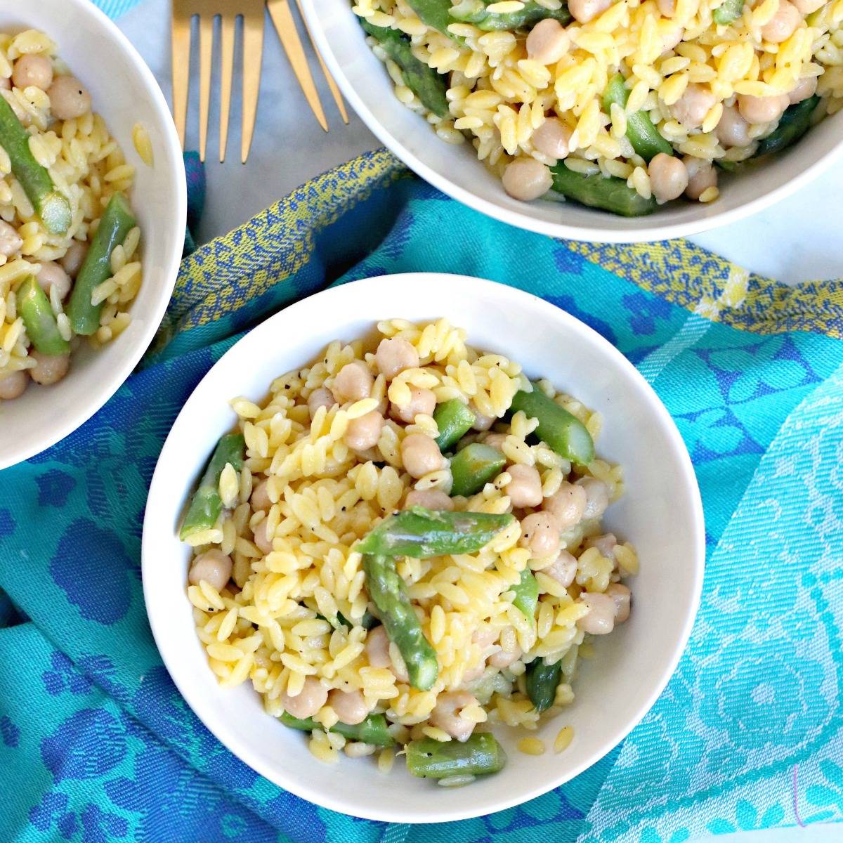 Bowls of lemon asparagus orzo with chickpeas.